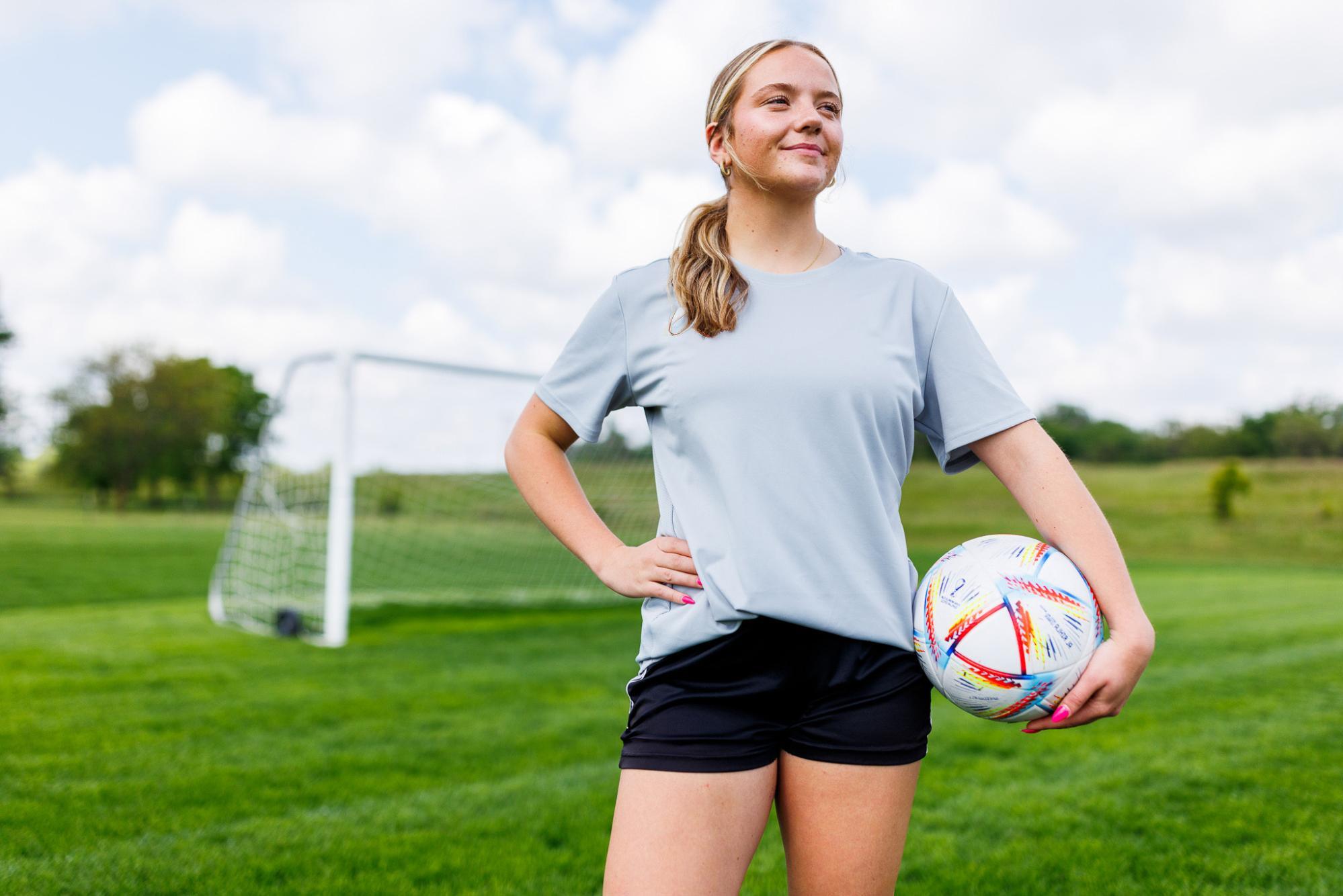 Woman holding soccer ball